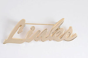 Links, Inc. Gold Cursive Lapel Pin