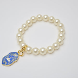 Pearl Bracelet with Zeta Shield Charm